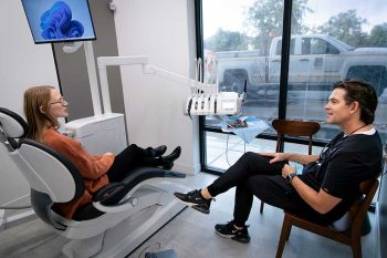 Dr. Baird speaking with a patient in a treatment room
